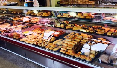 The glass counters full of sausage rolls, pies, scotch eggs and other meat and bakery produce at A Laverack & Son Butchers and Bakers, in East Yorkshi